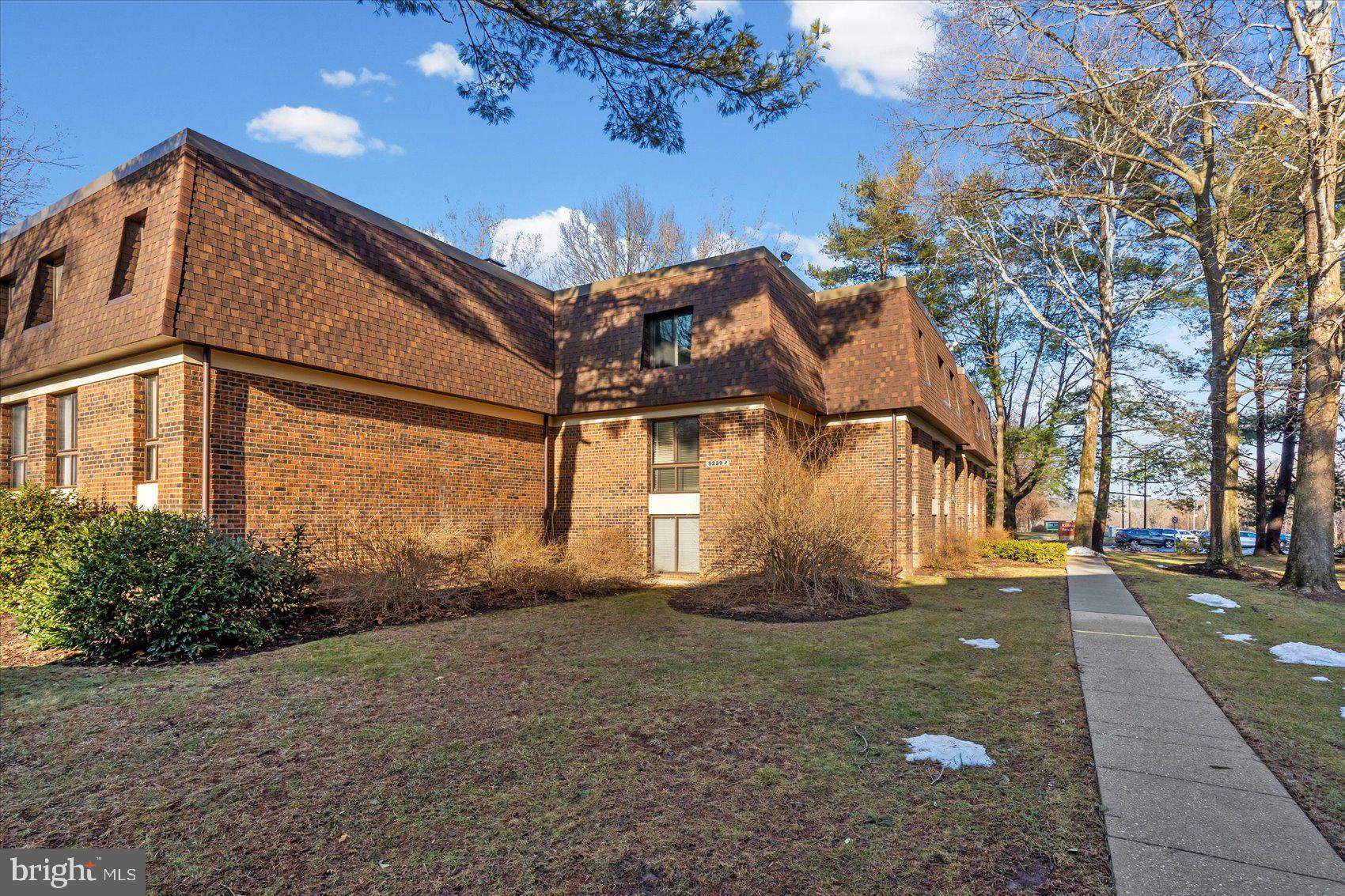 5239 West Running Brook Road, Unit 302 Columbia, MD 21044 - Photo 30 of 33 a view of a house with a yard