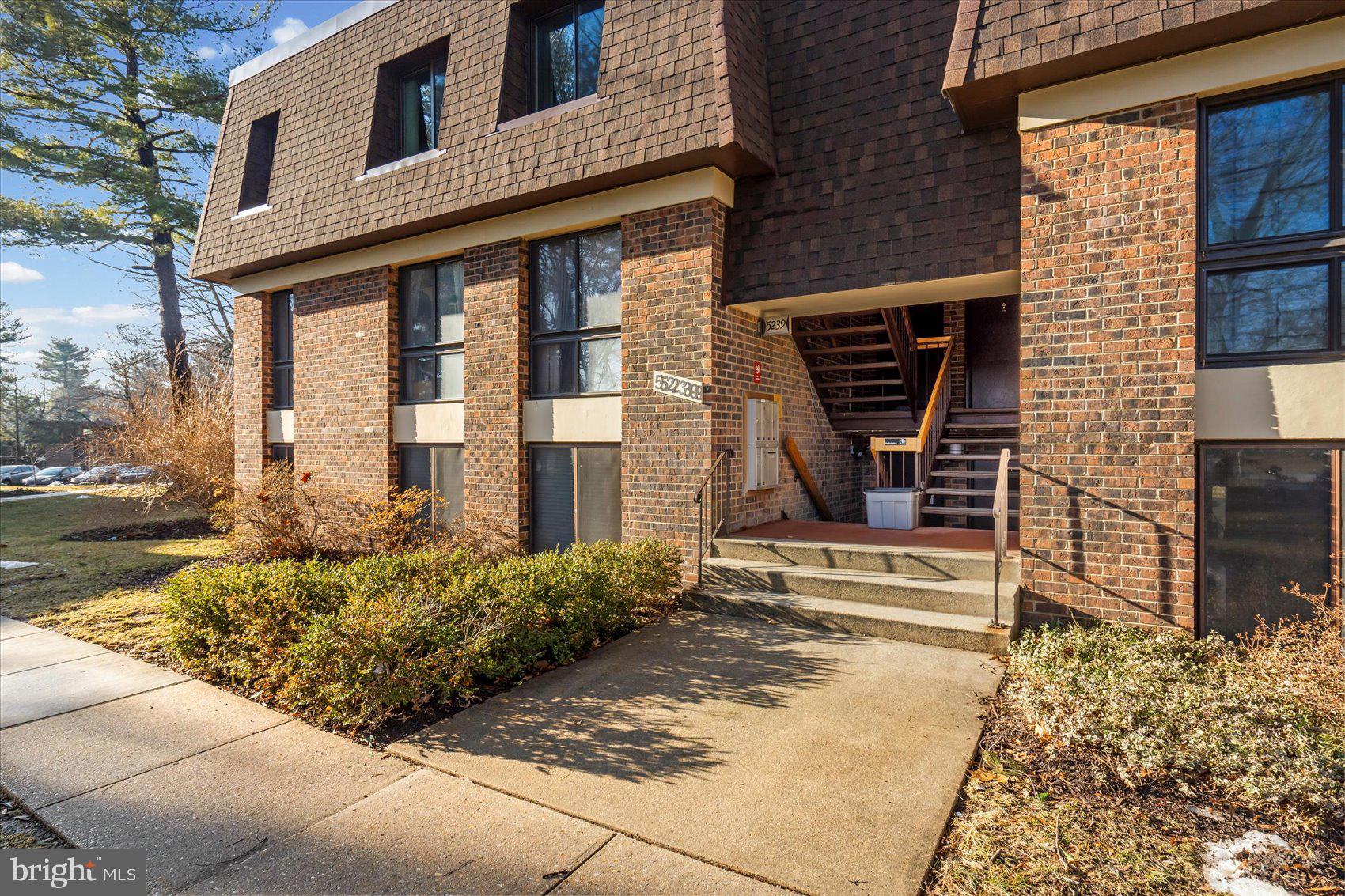 5239 West Running Brook Road, Unit 302 Columbia, MD 21044 - Photo 31 of 33 a front view of a house with a yard