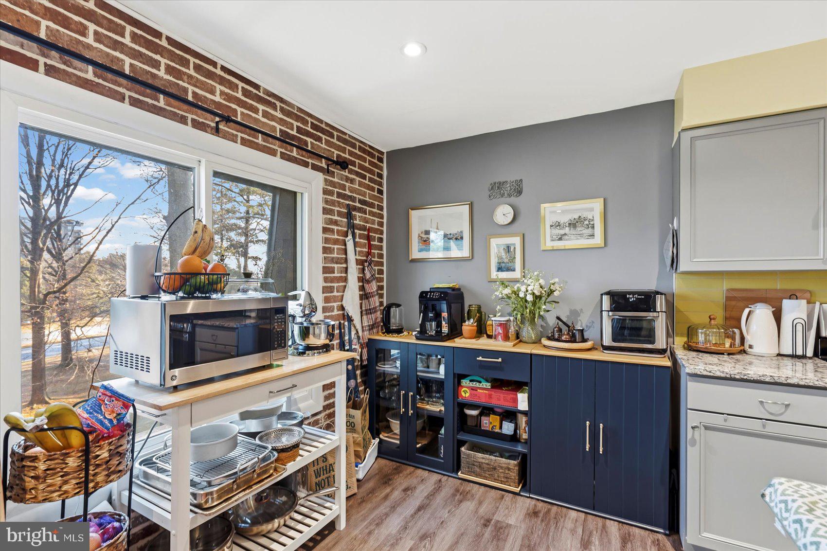 5239 West Running Brook Road, Unit 302 Columbia, MD 21044 - Photo 10 of 33 a living room with furniture and a flat screen tv