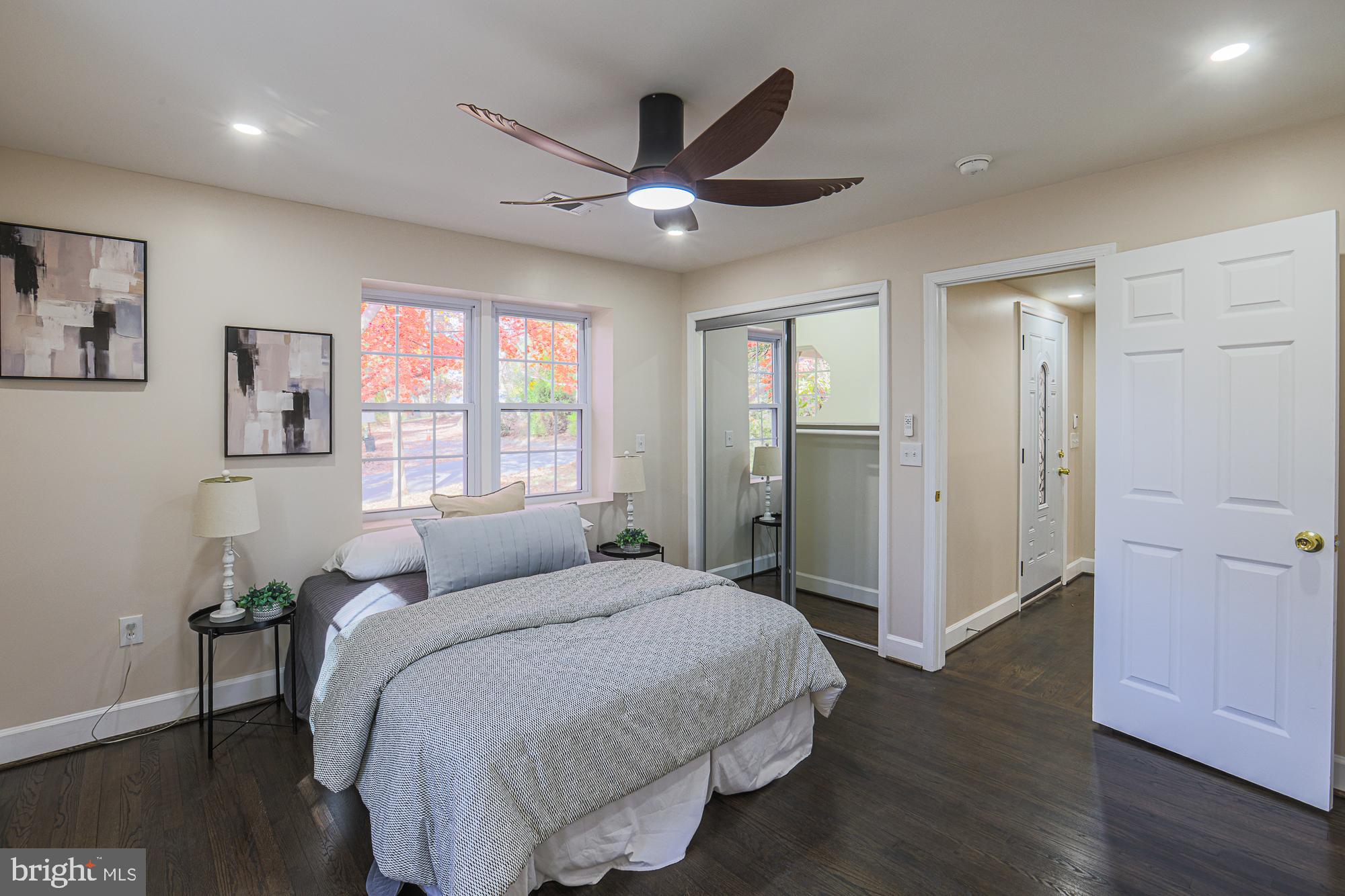 3641 Campfield Road Baltimore, MD 21207 - Photo 19 of 61 a spacious bedroom with a bed and a window