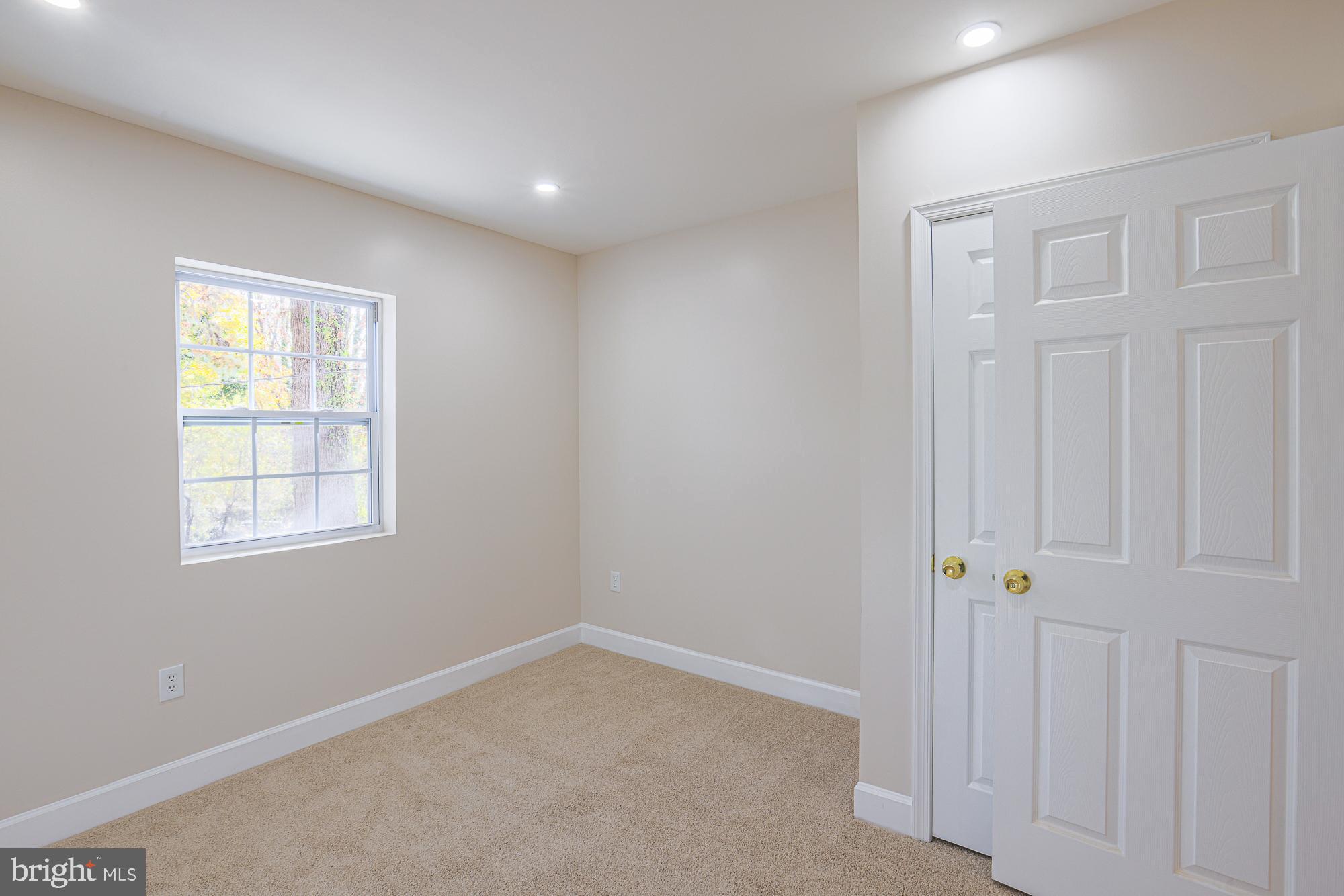 3641 Campfield Road Baltimore, MD 21207 - Photo 29 of 61 an empty room with windows