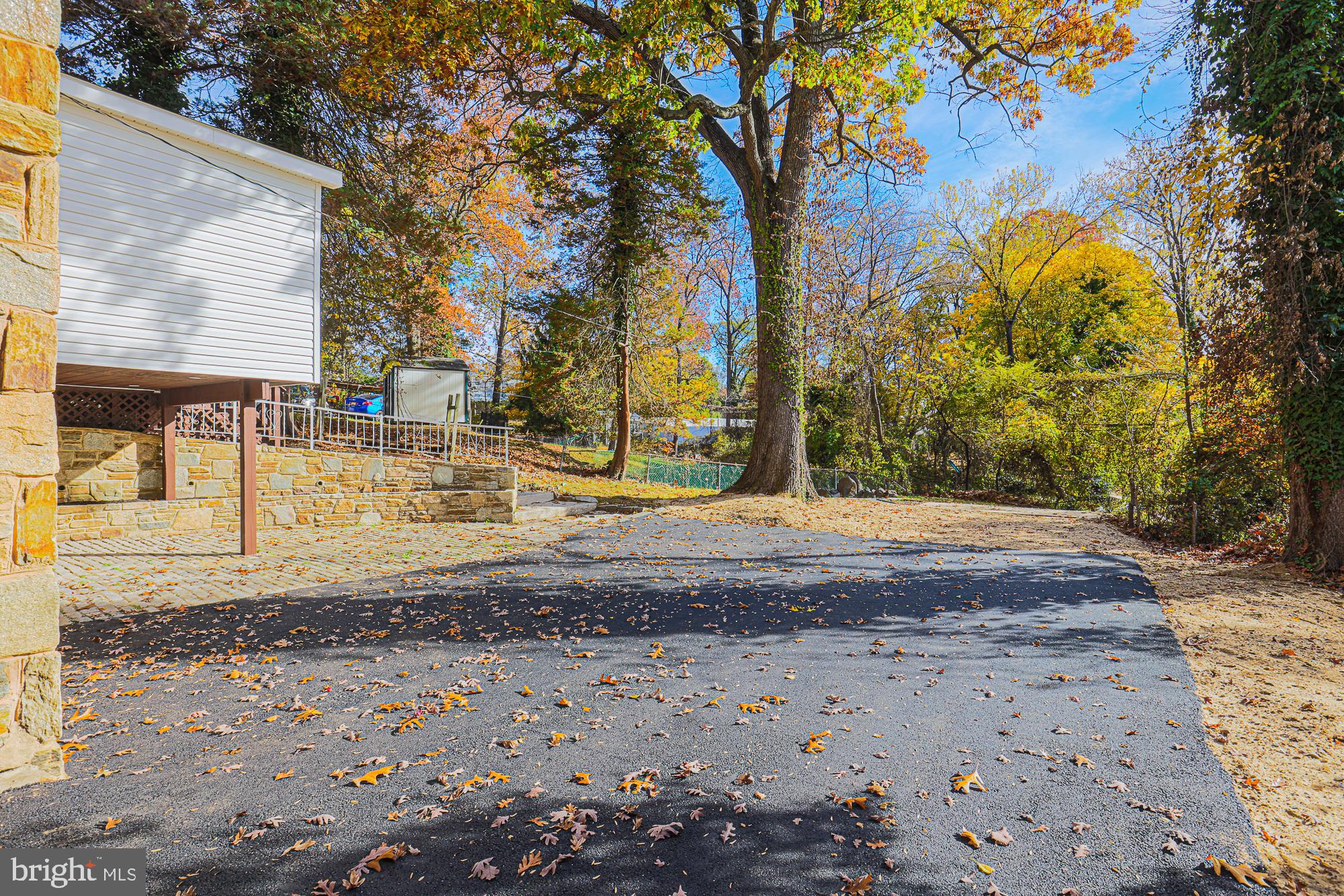 3641 Campfield Road Baltimore, MD 21207 - Photo 50 of 61 a view of a yard with yellow lighting