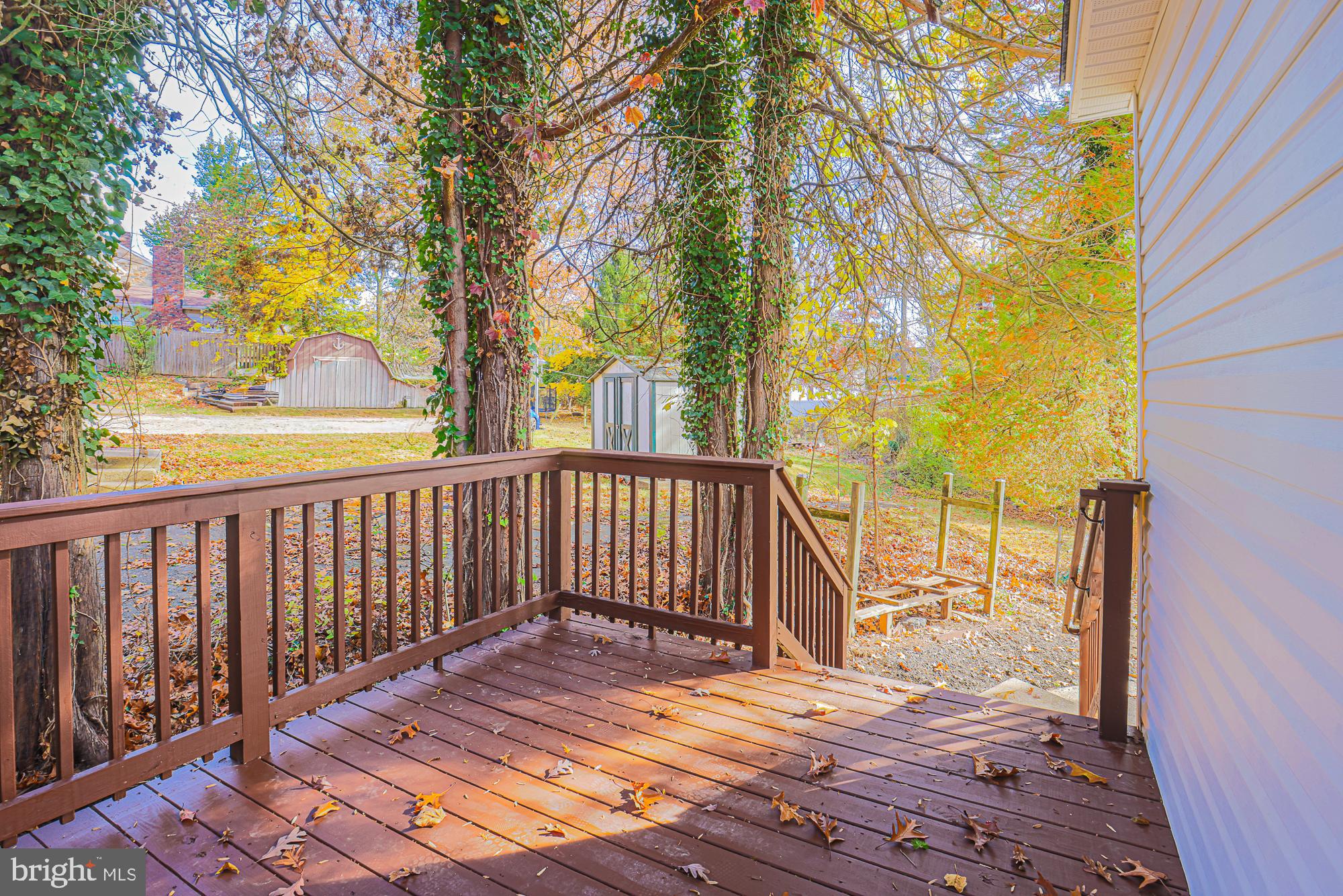 3641 Campfield Road Baltimore, MD 21207 - Photo 54 of 61 a view of balcony with wooden floor and fence