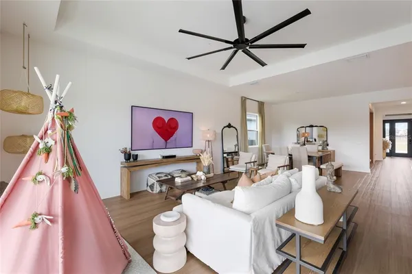 a room with furniture a rug and white walls
