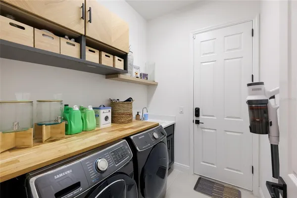a kitchen with stainless steel appliances a sink and cabinets