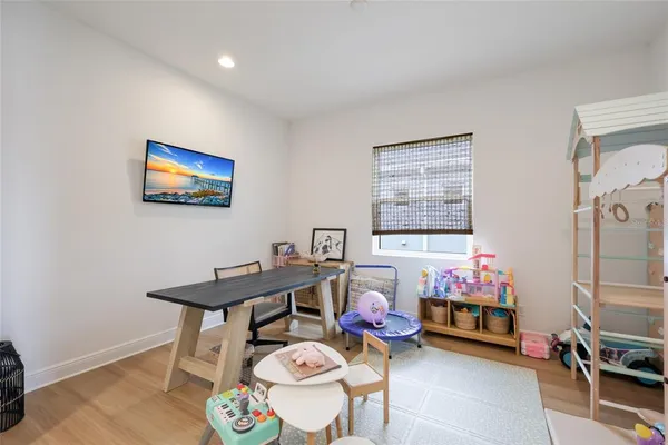 a reading room with furniture and a window