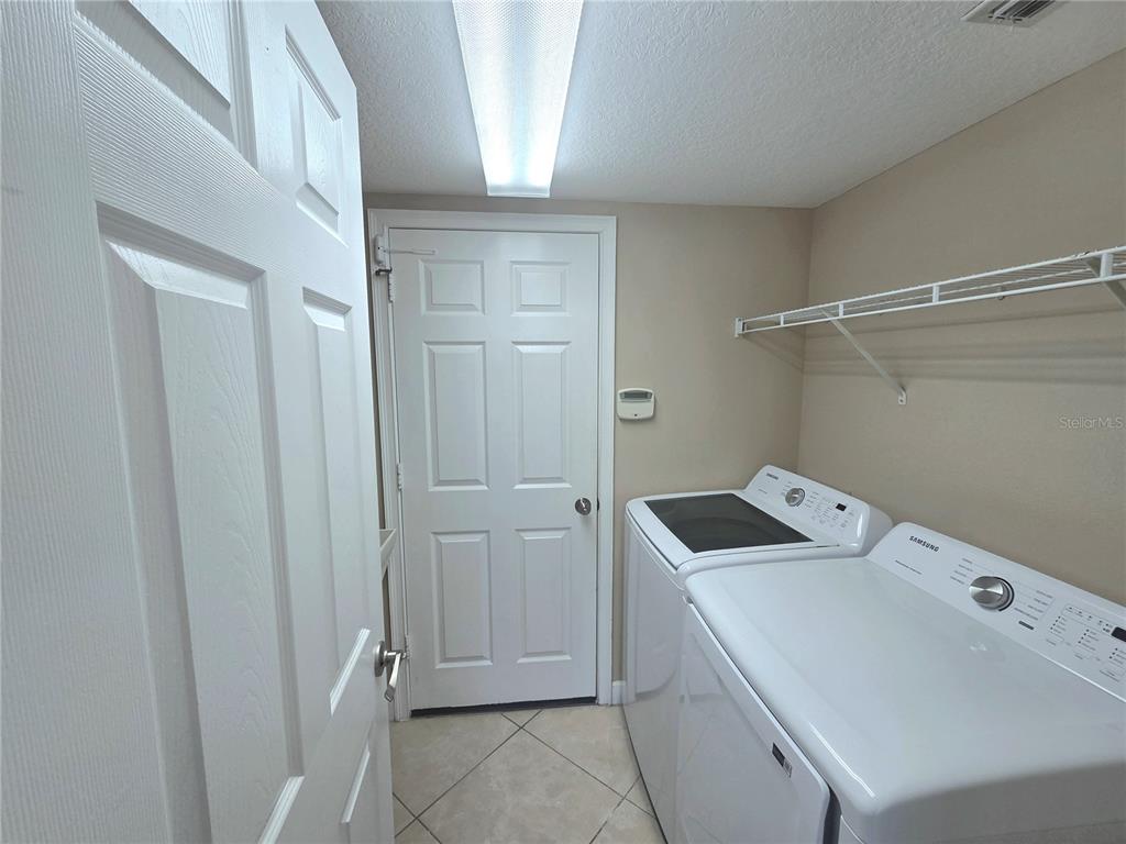 2898 Ashton Road Sarasota, FL 34231 - Photo 23 of 29 a room with storage and utility