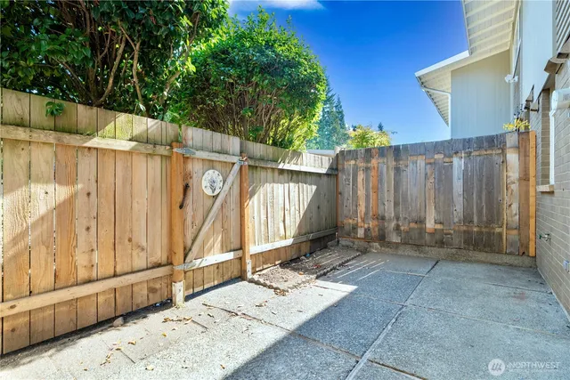a view of a wooden door with a house
