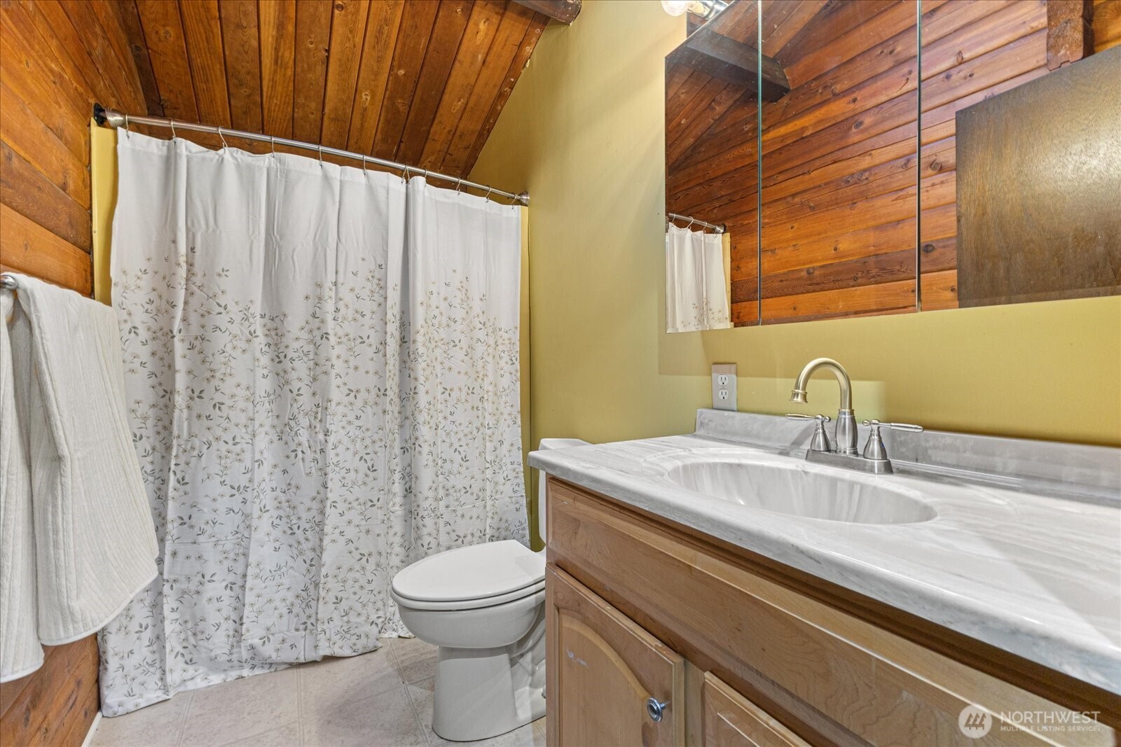 86 North Camano Ridge Road Camano Island, WA 98282 - Photo 23 of 33 a bathroom with a sink a toilet and shower curtain