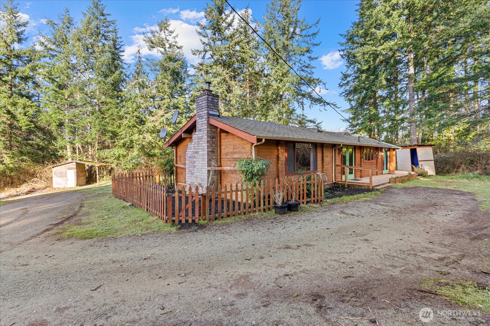 86 North Camano Ridge Road Camano Island, WA 98282 - Photo 26 of 33 a view of a house with a yard and tree s