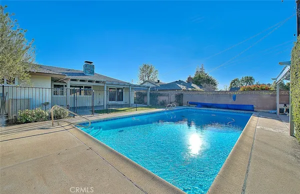 a view of a swimming pool with a patio