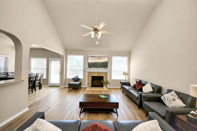a living room with furniture fireplace and window