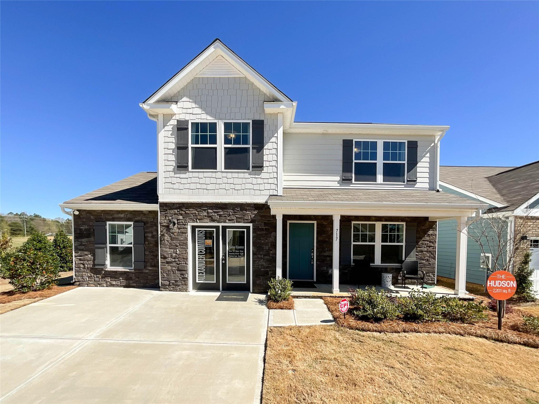 717 Alexander Commons Drive Monroe, NC 28112 - Photo 1 of 33 a front view of a house with a yard in front of it