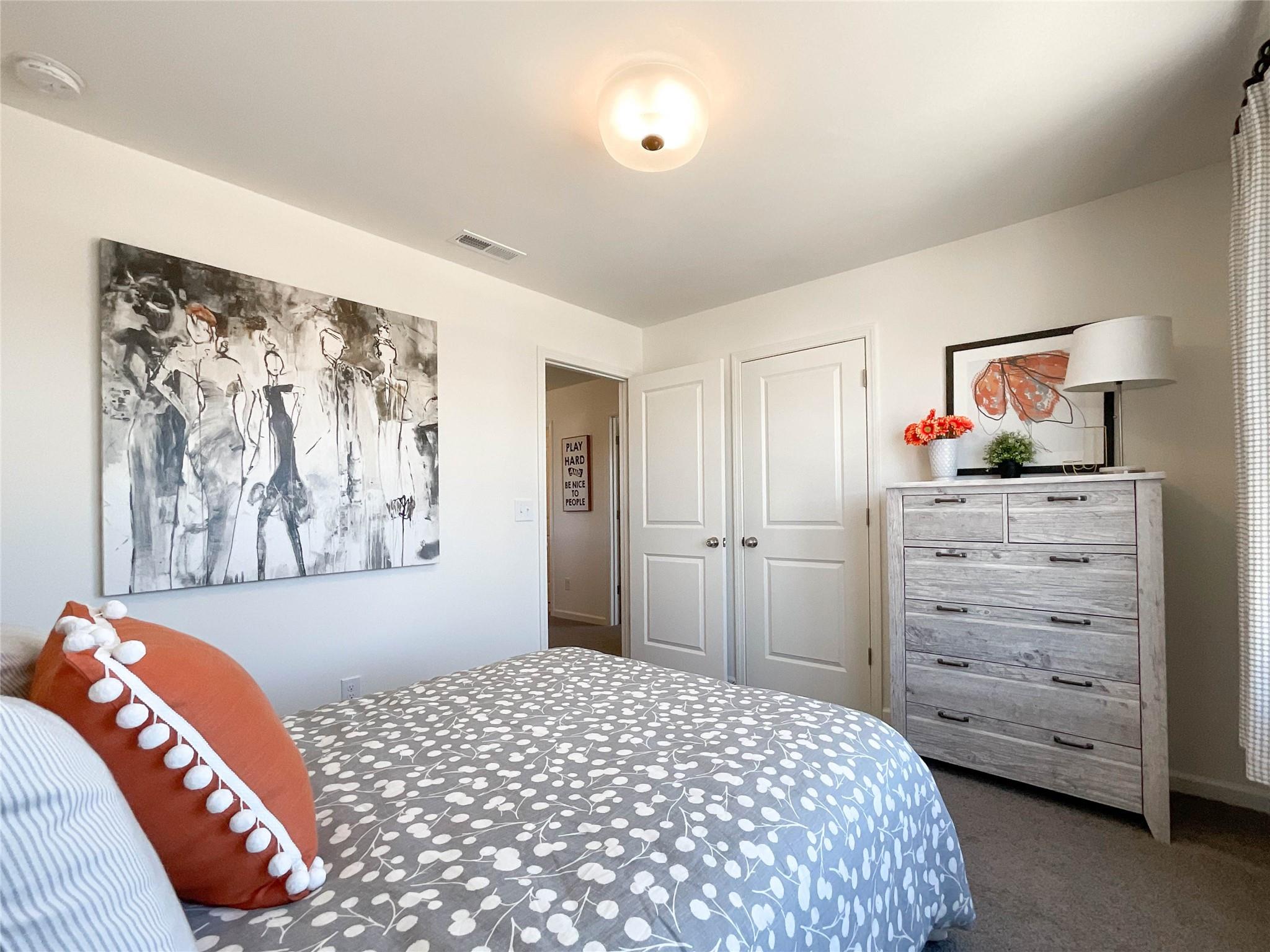 717 Alexander Commons Drive Monroe, NC 28112 - Photo 17 of 33 a bedroom with a bed and a painting on the wall