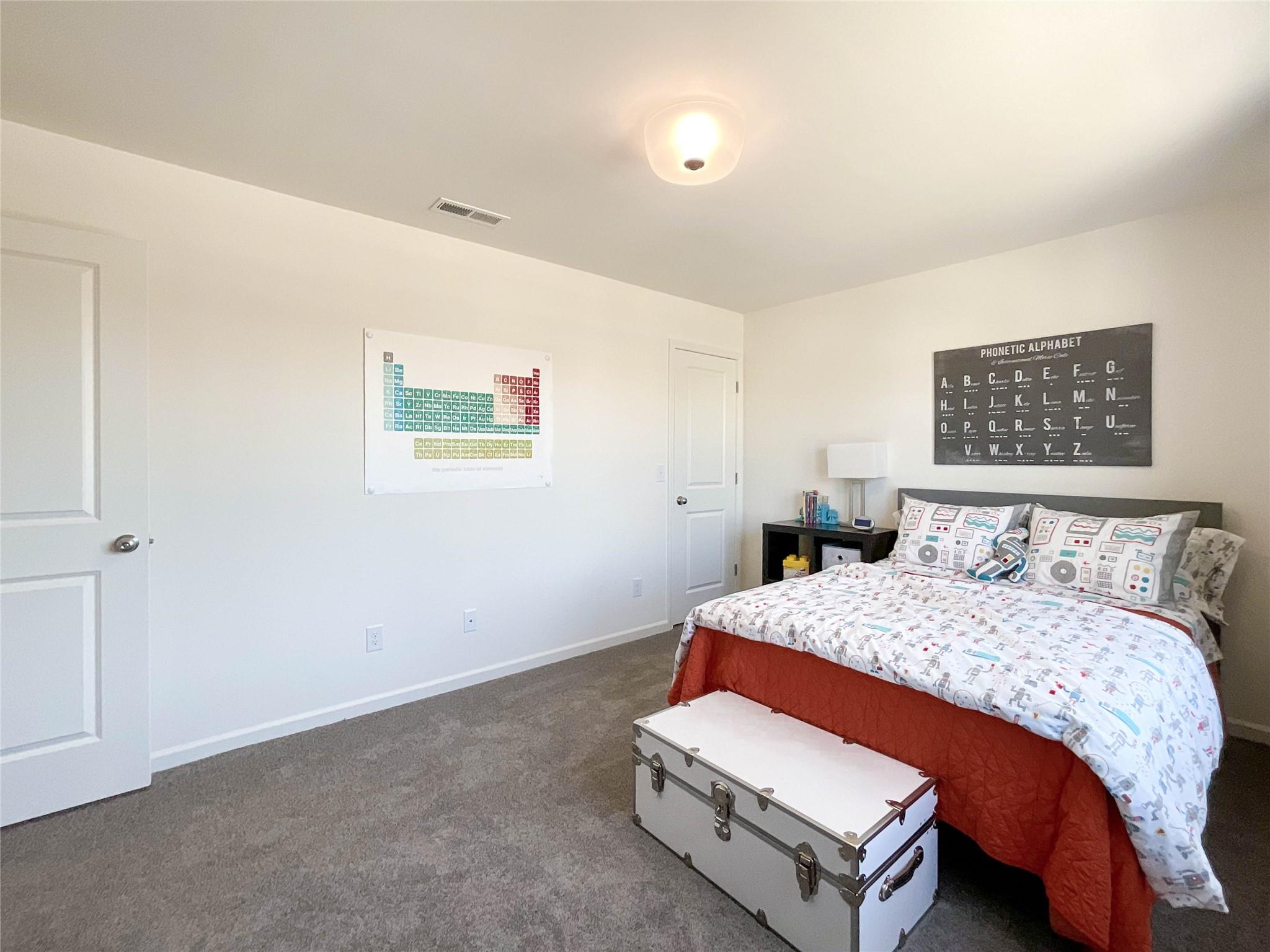 717 Alexander Commons Drive Monroe, NC 28112 - Photo 19 of 33 a bedroom with a bed and a wall painting