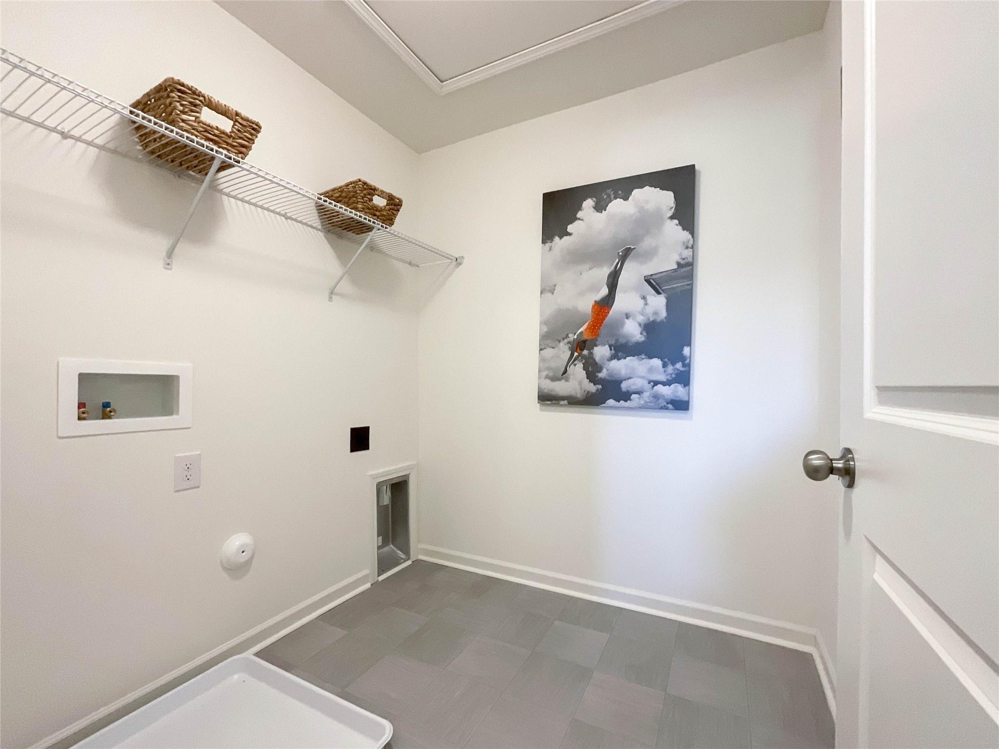 717 Alexander Commons Drive Monroe, NC 28112 - Photo 21 of 33 a view of a room with wall painting and a fan