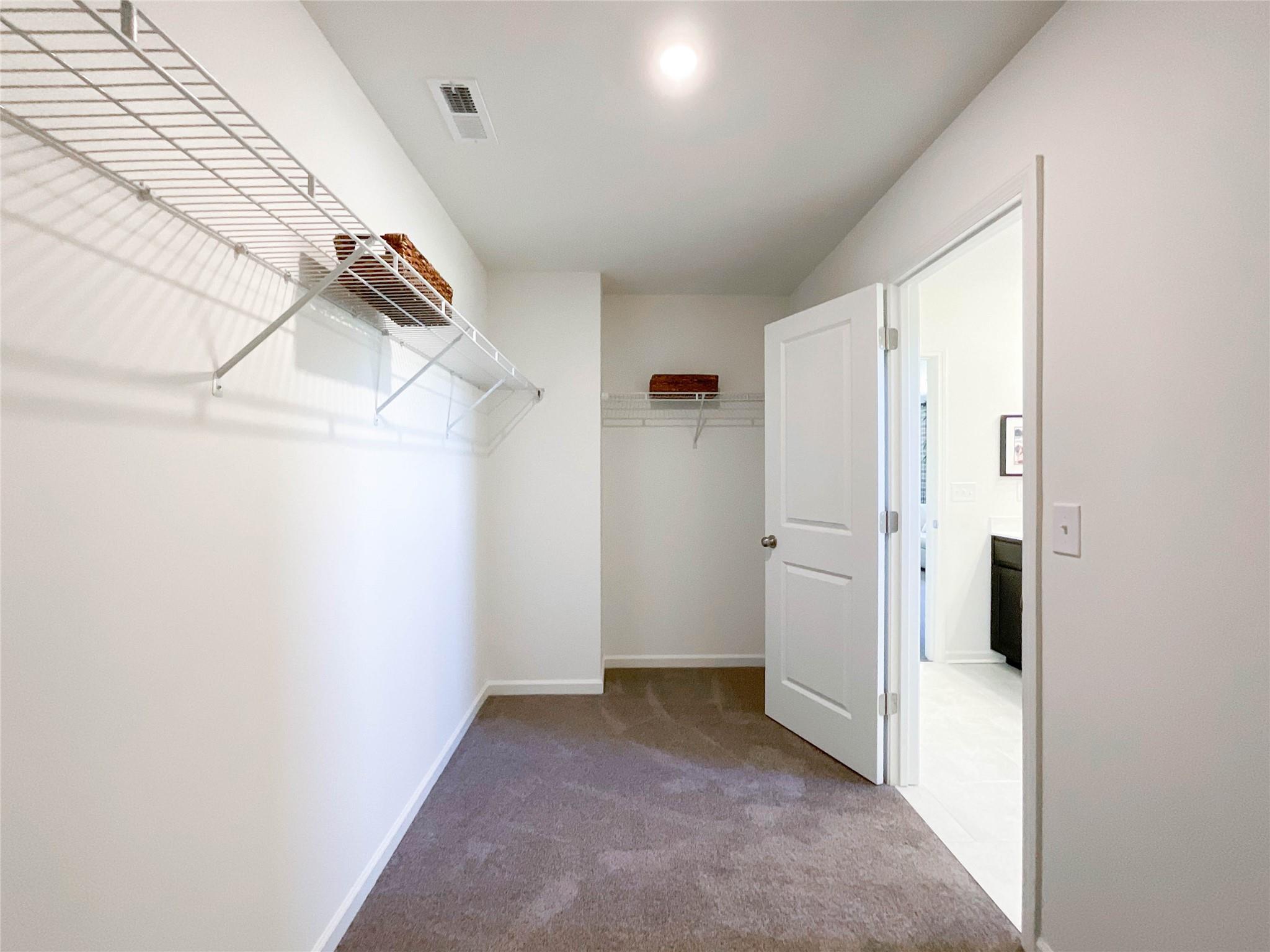 717 Alexander Commons Drive Monroe, NC 28112 - Photo 27 of 33 a view of a livingroom with an empty space and a hallway