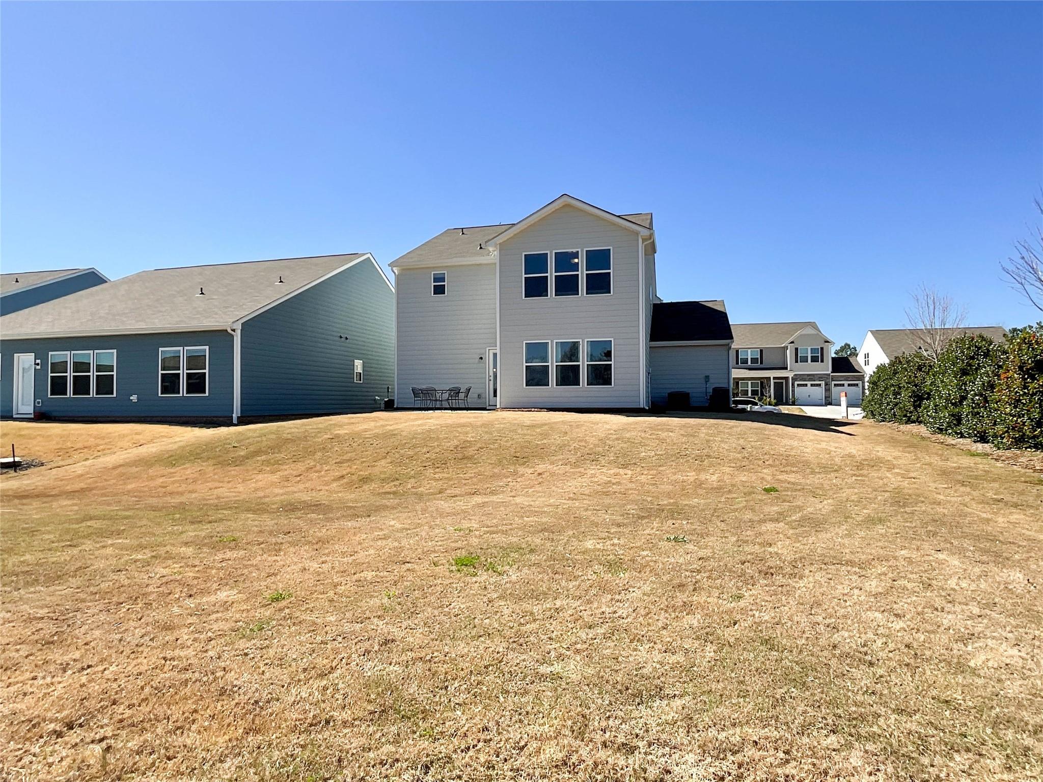 717 Alexander Commons Drive Monroe, NC 28112 - Photo 29 of 33 a large house with a swimming pool
