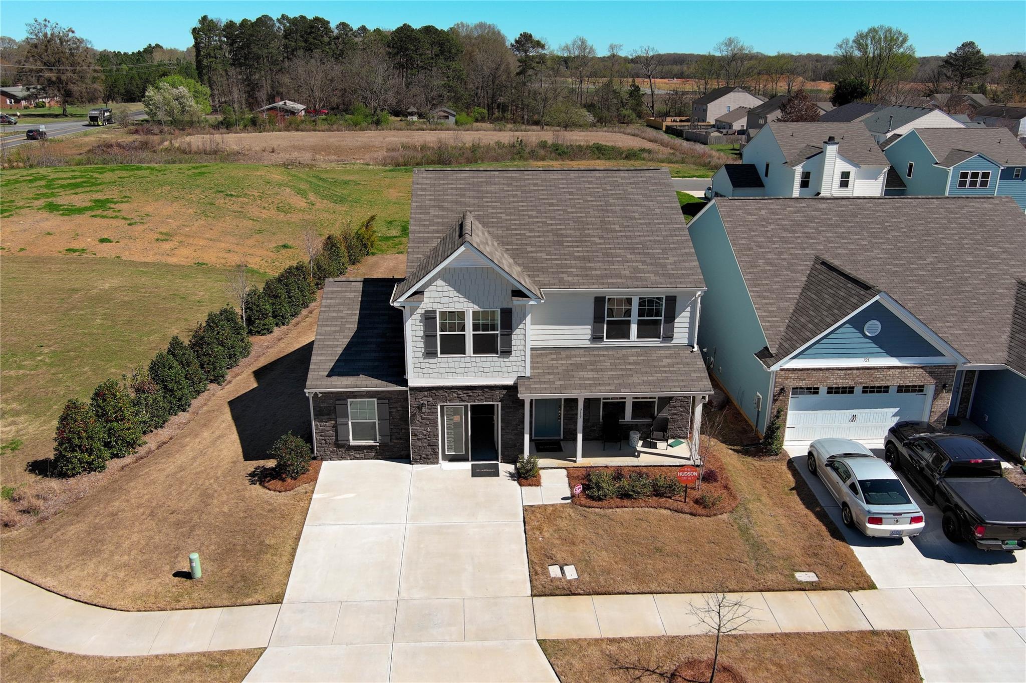 717 Alexander Commons Drive Monroe, NC 28112 - Photo 31 of 33 a view of a house with pool and a yard