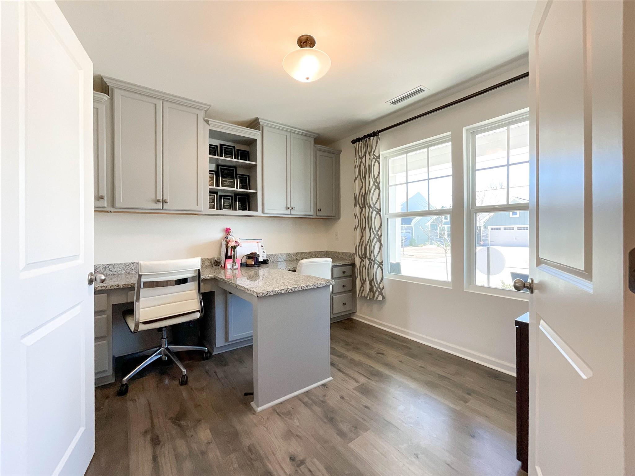 717 Alexander Commons Drive Monroe, NC 28112 - Photo 4 of 33 a view of a workspace with furniture and a window