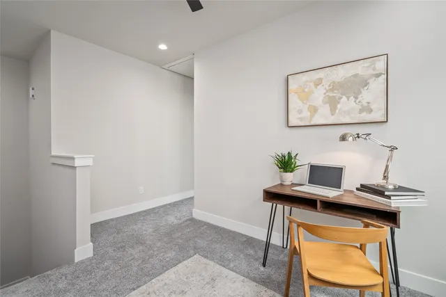a living room with lots of furniture and kitchen view