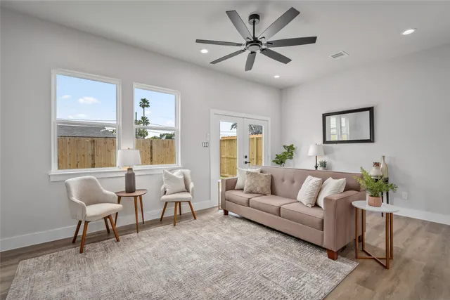 a living room with furniture and a large window