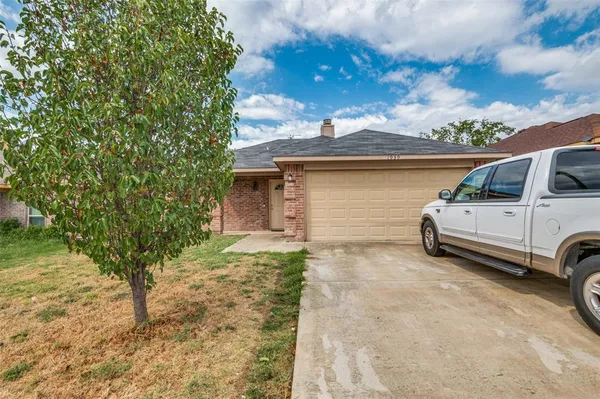 a view of a car in front of a house