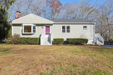 a front view of a house with a yard
