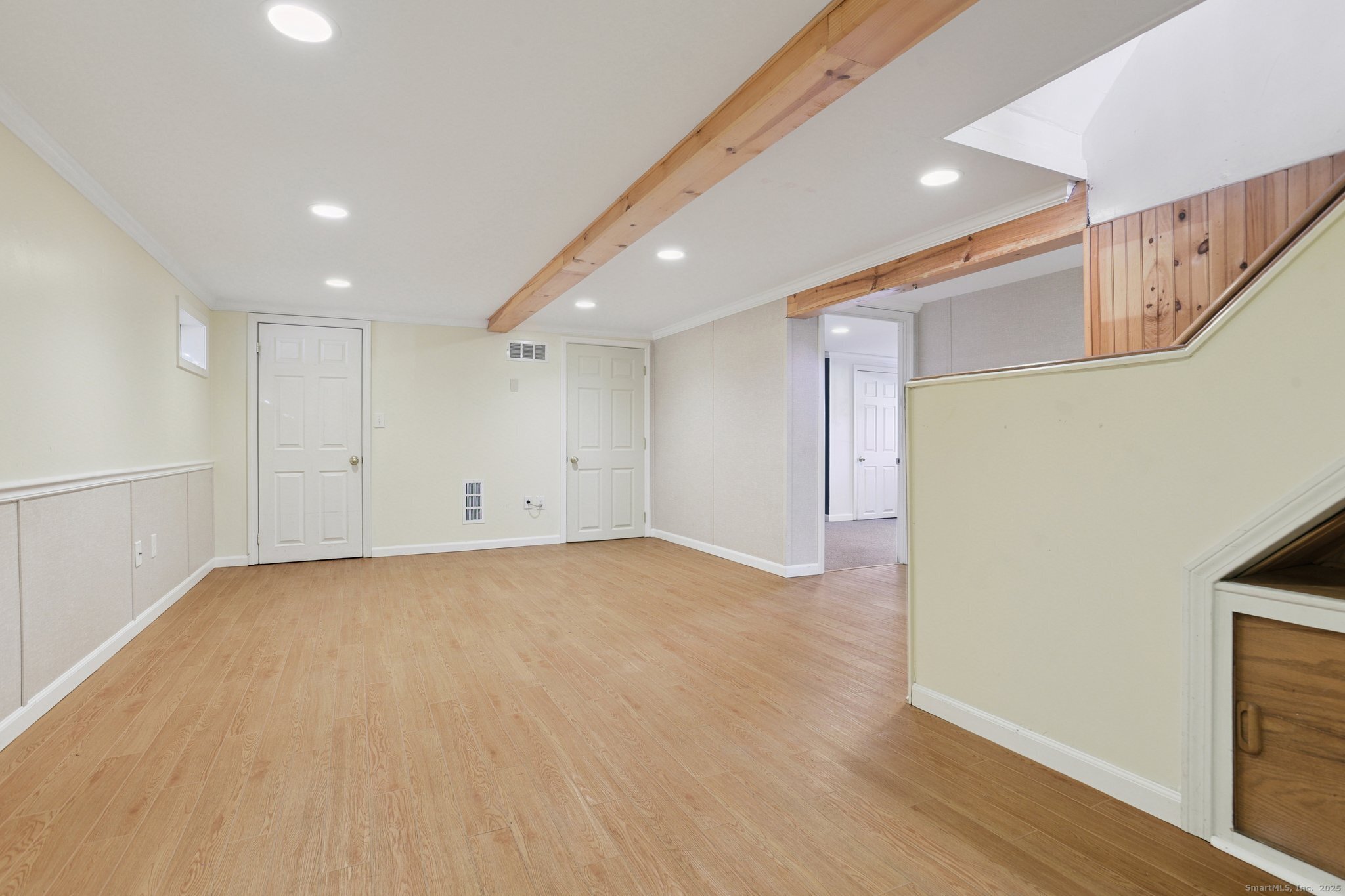 109 Valley Road Groton, CT 06340 - Photo 20 of 28 a view of an empty room with wooden floor