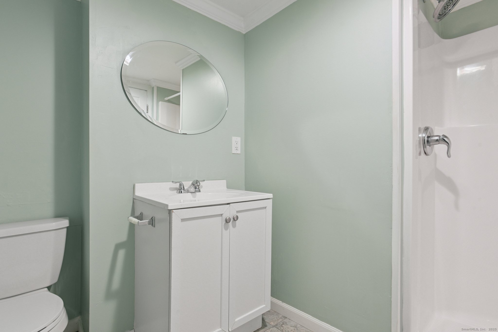 109 Valley Road Groton, CT 06340 - Photo 23 of 28 a bathroom with a sink a mirror and a toilet