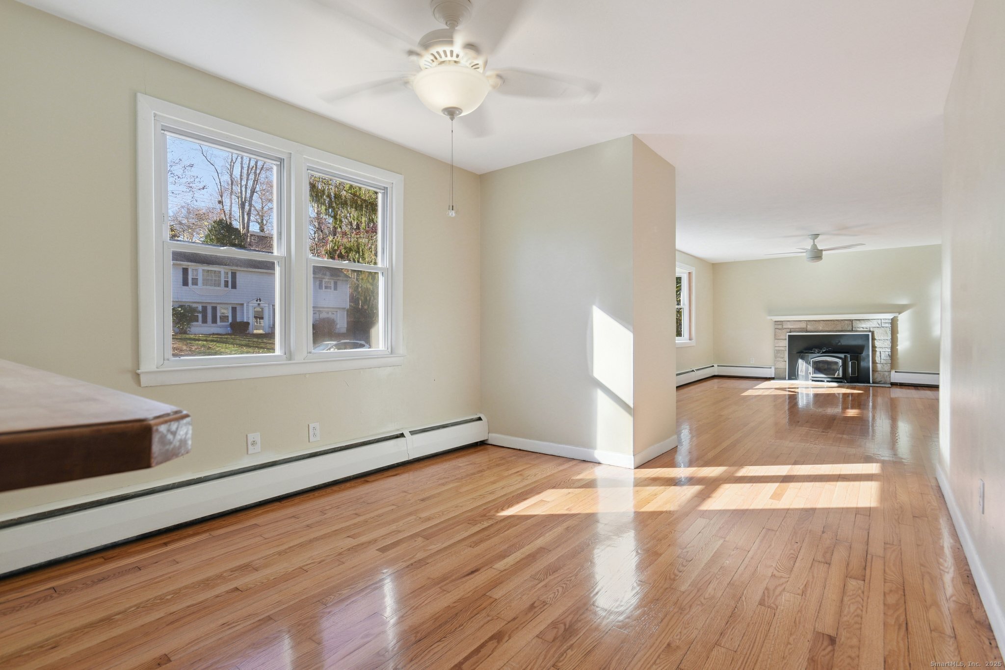109 Valley Road Groton, CT 06340 - Photo 9 of 28 a view of empty room with wooden floor and fan