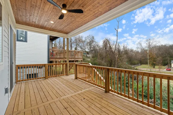 a view of a balcony with wooden floor