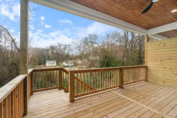 a view of balcony with wooden floor
