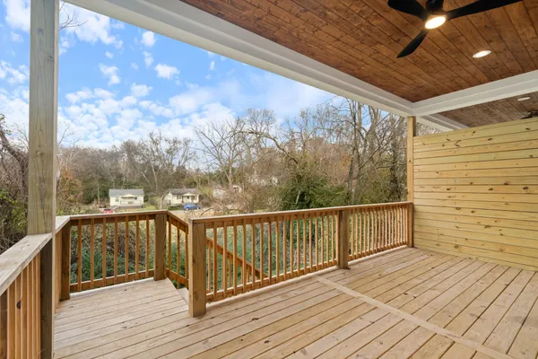 a view of a balcony with wooden floor