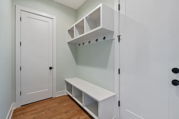 a view of walk in closet with clothes