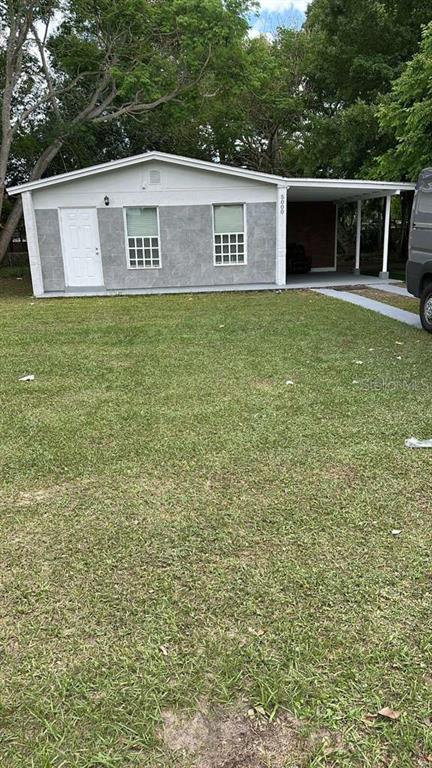 5000 Manduria Street Orlando, FL 32819 - Photo 1 of 17 a view of a house with a yard