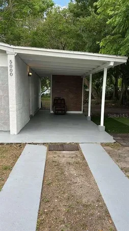 an outdoor view of house and garage