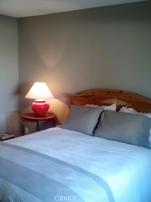 32492 Azores Road Dana Point, CA 92629 - Photo 11 of 18 a bedroom with a bed and a lamp