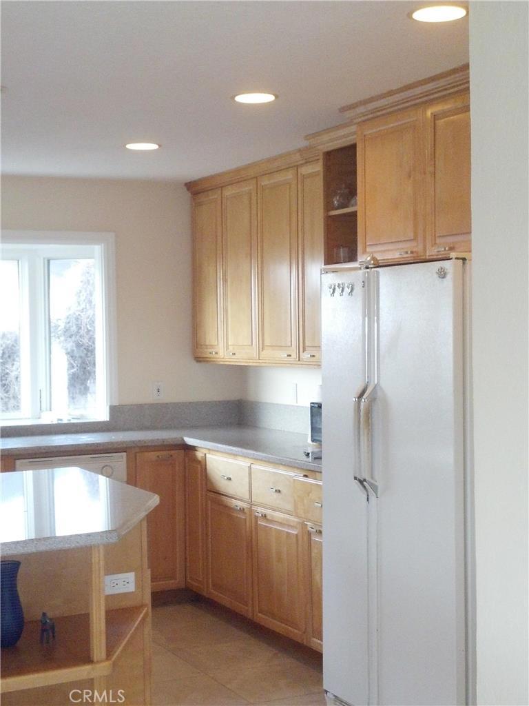 32492 Azores Road Dana Point, CA 92629 - Photo 7 of 18 a kitchen with a sink a refrigerator and window