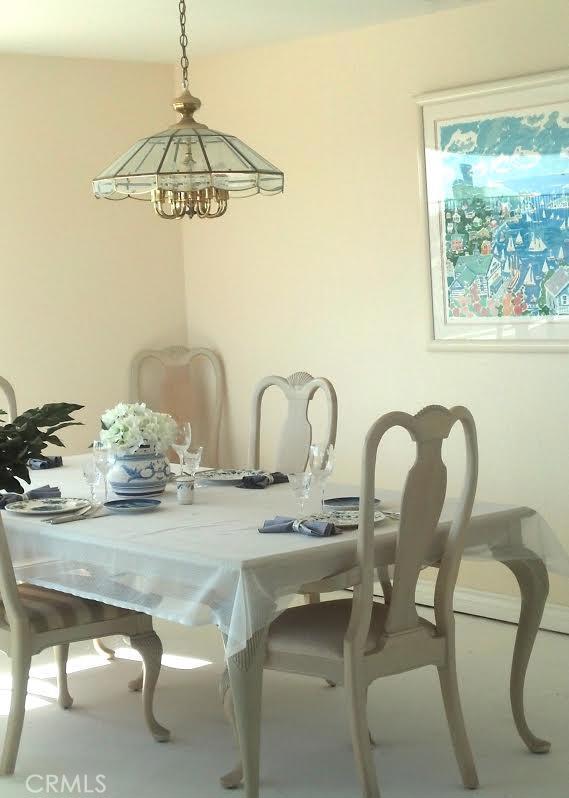 32492 Azores Road Dana Point, CA 92629 - Photo 9 of 18 a dining table with a glass table and chairs