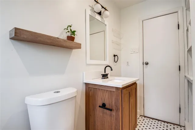 a view of bathroom with a sink and toilet