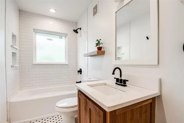 a bathroom with a sink a toilet and a bathtub