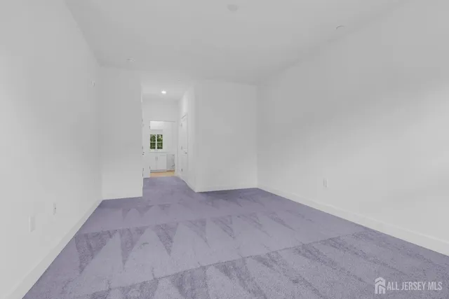 a bathroom with a shower sink vanity mirror and toilet