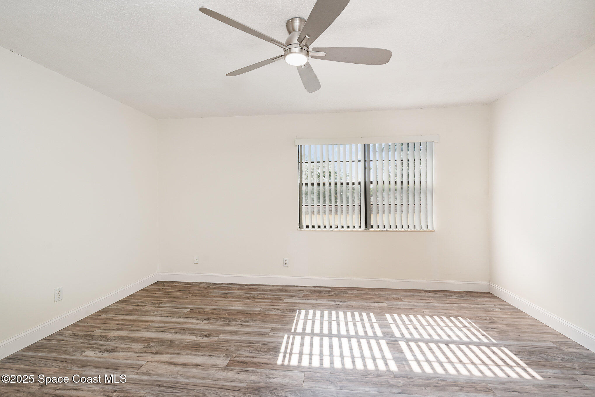 3444 Partridge Court Melbourne, FL 32935 - Photo 18 of 78 a view of an empty room with a window