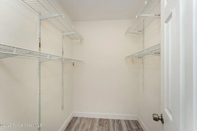 a white toilet sitting next to a bath tub