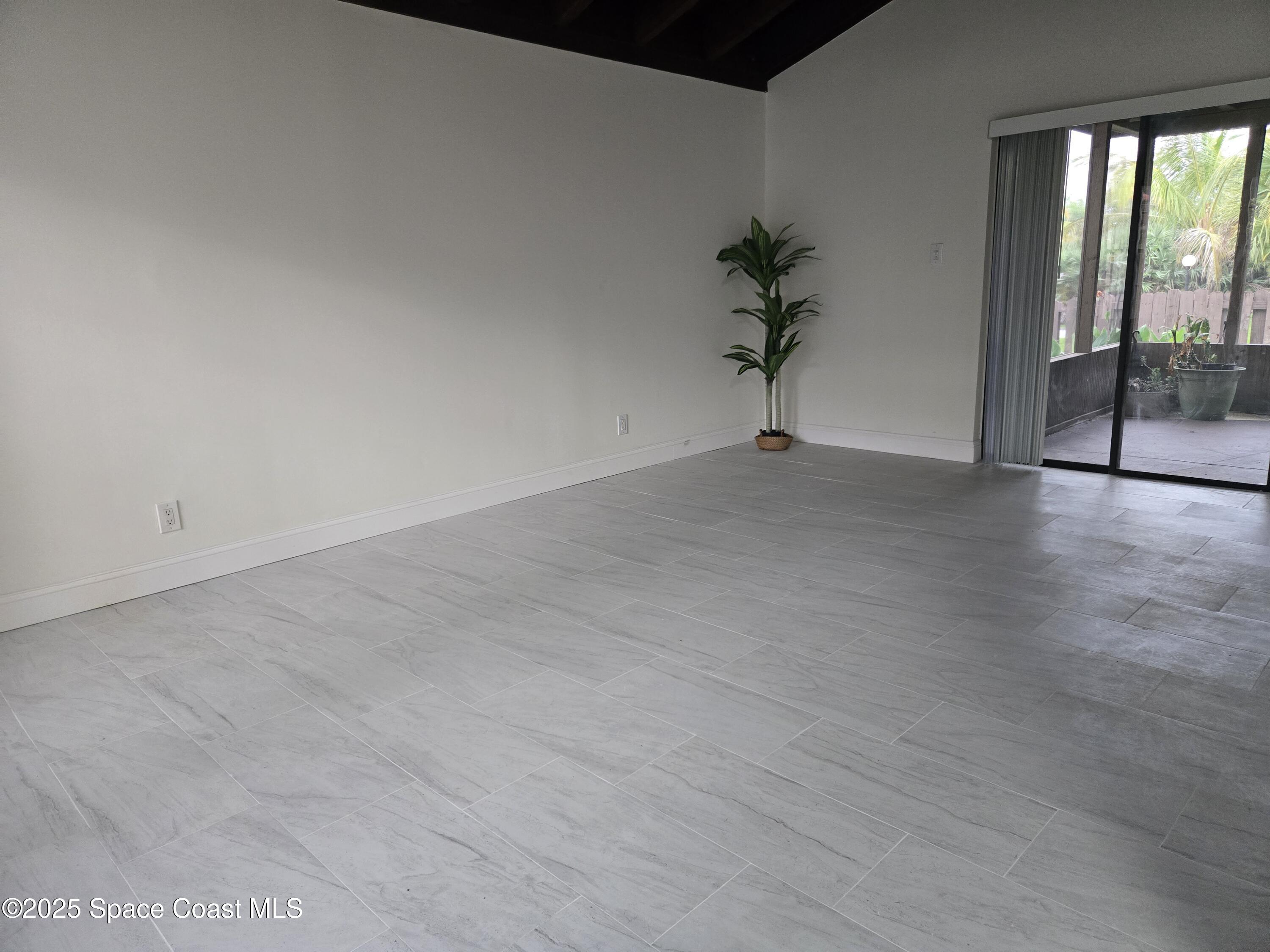 3444 Partridge Court Melbourne, FL 32935 - Photo 28 of 78 a view of a room with a potted plant