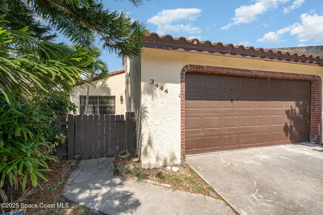 a front view of a house with a garage