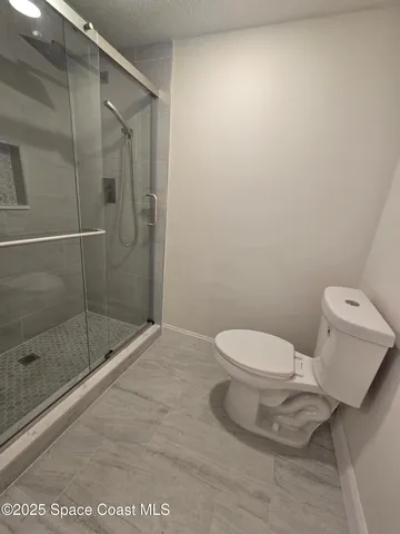 a bathroom with a sink a toilet and vanity