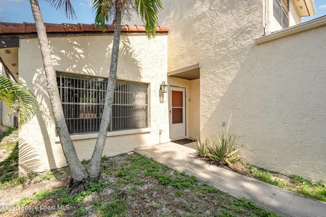 a view of a hallway with wooden floor and entryway