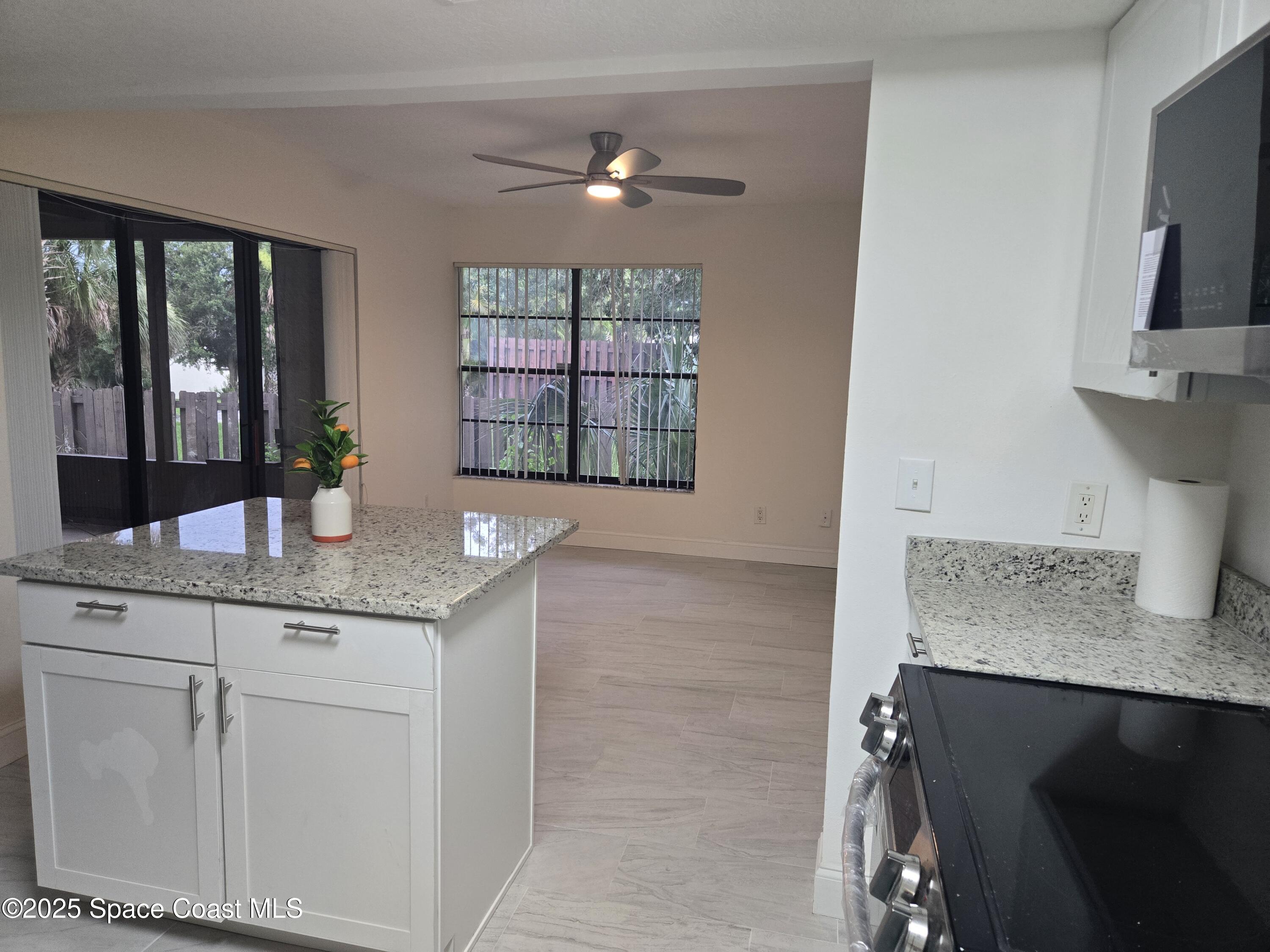 3444 Partridge Court Melbourne, FL 32935 - Photo 46 of 78 a kitchen with a sink and a window